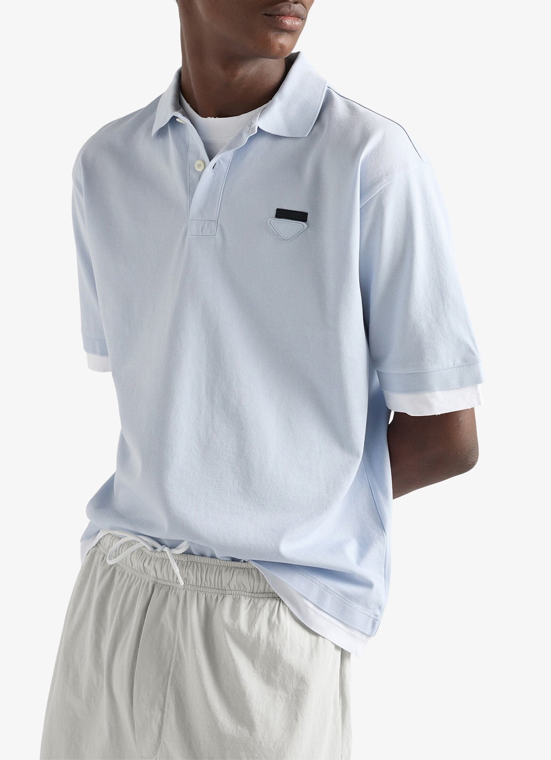 Prada Oversized fit polo met contrast - detail lichtblauw