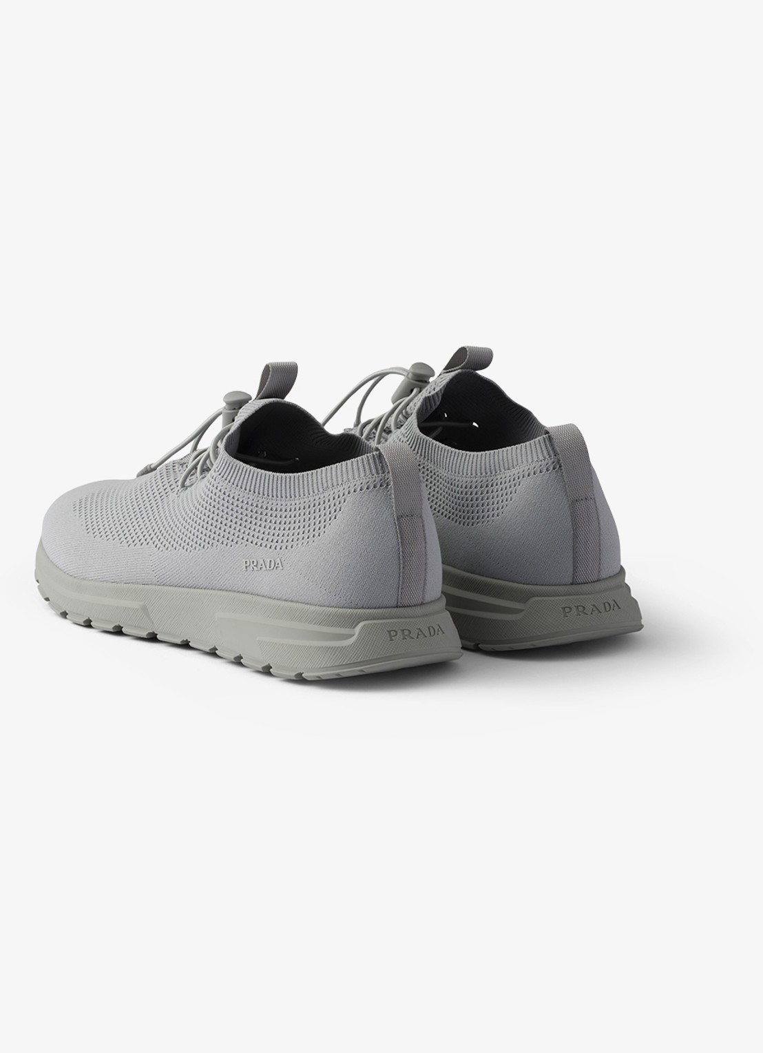 Prada Prax sneaker met gebreid bovenwerk - achterkant grijs
