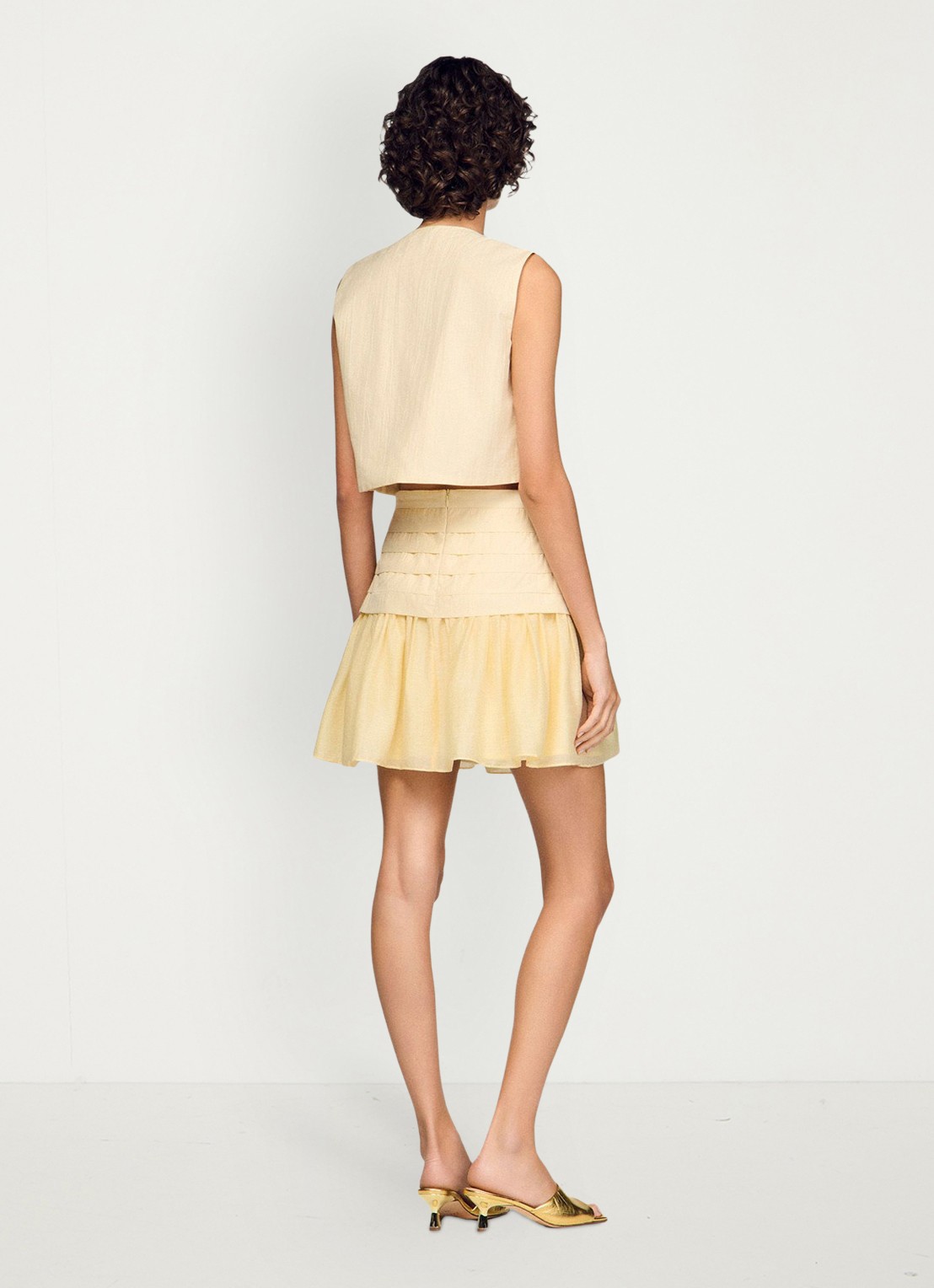 Sandro Mini rok met plooien - achterkant 7 vanilla / geel