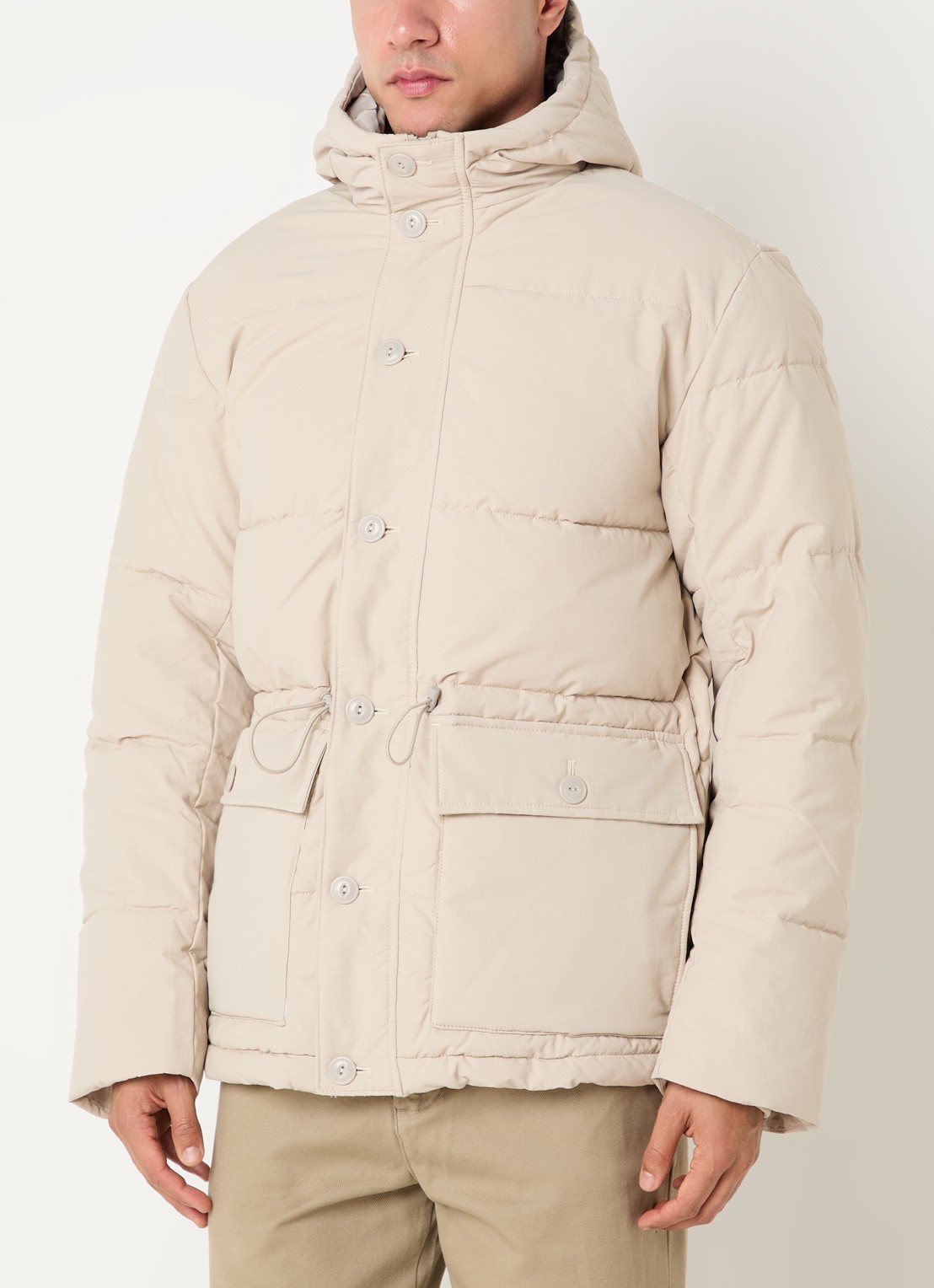 Selected Vincent puffer jack met trekkoord en klepzakken - detail beige