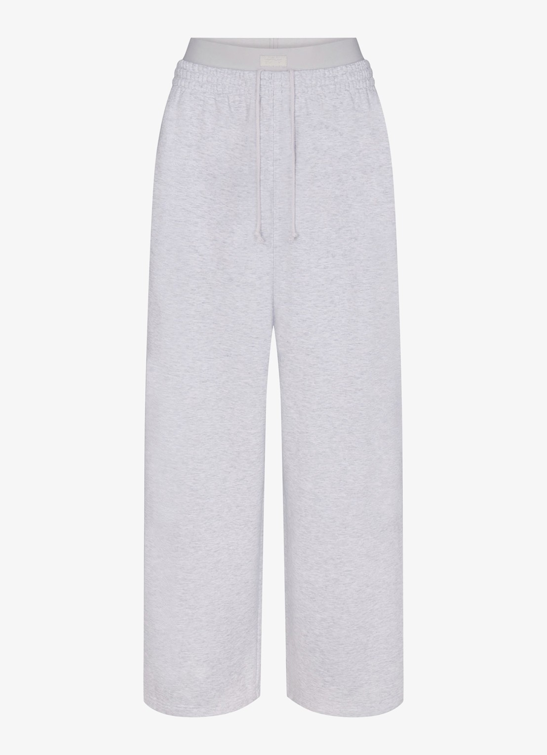 SKIMS Cotton Fleece high waist wide fit joggingbroek met logoband - voorkant lichtgrijs