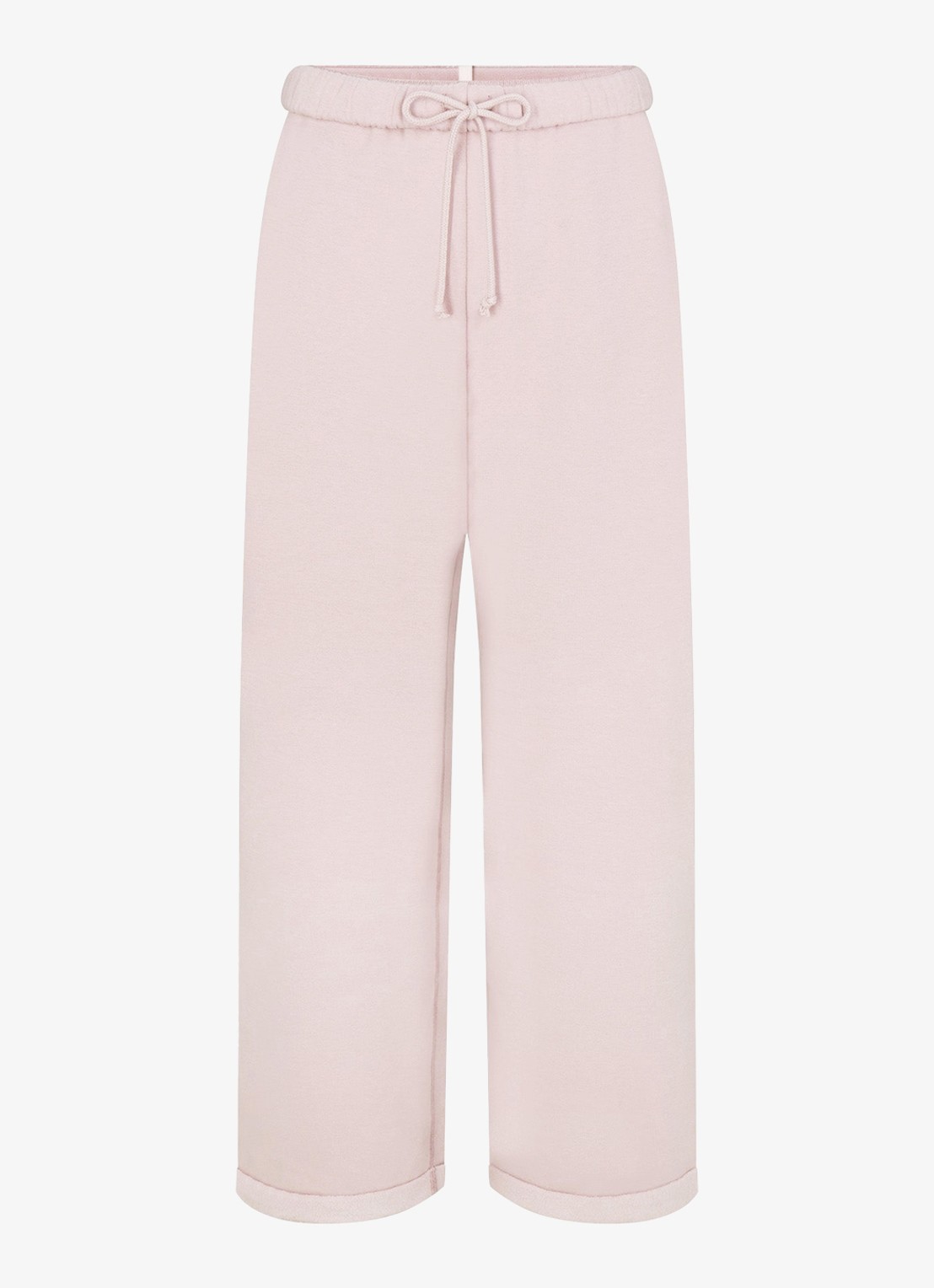 SKIMS Cotton Fleece mid waist straight fit loungebroek met steekzakken - voorkant lichtroze