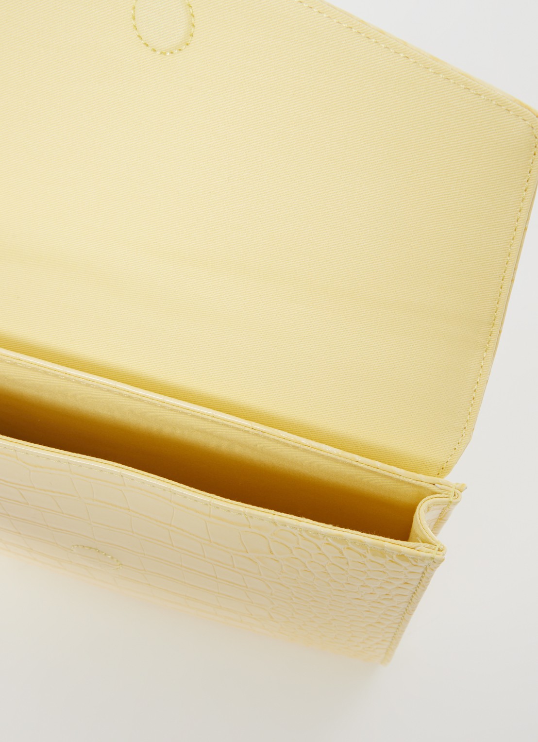 Ted Baker Crocey clutch met crocostructuur - detail 2 lichtgeel