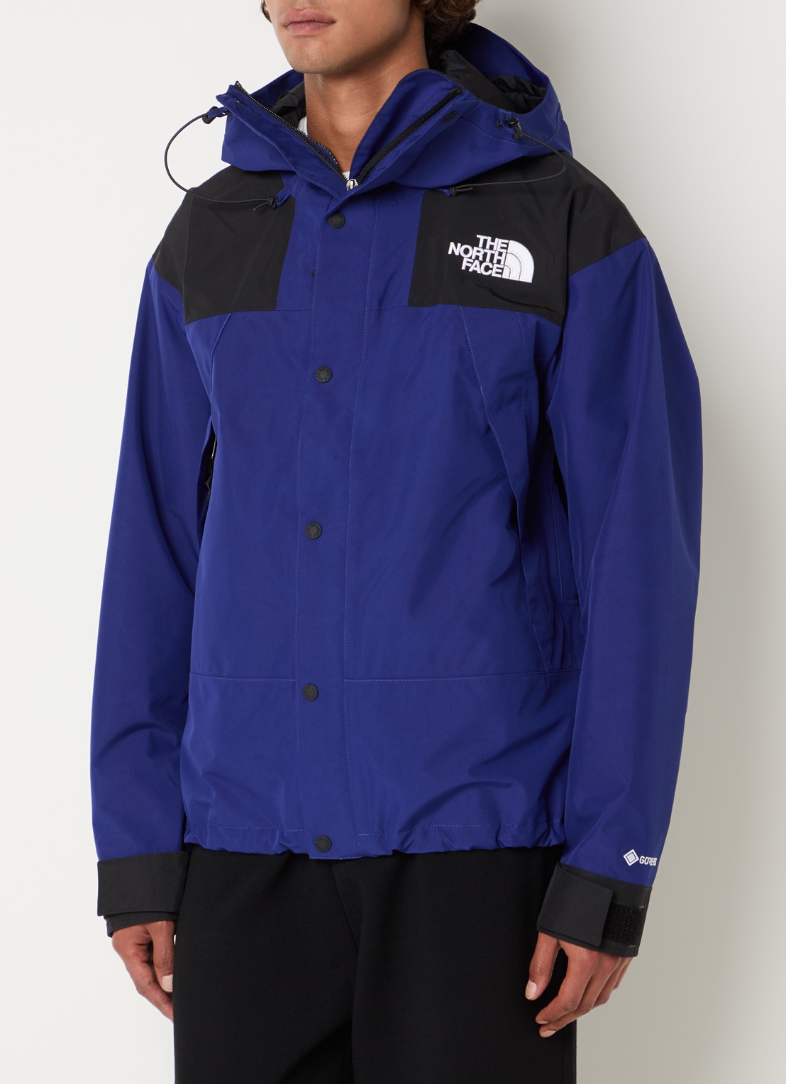 The North Face Gtx windjack met capuchon en ritszakken - detail blauw