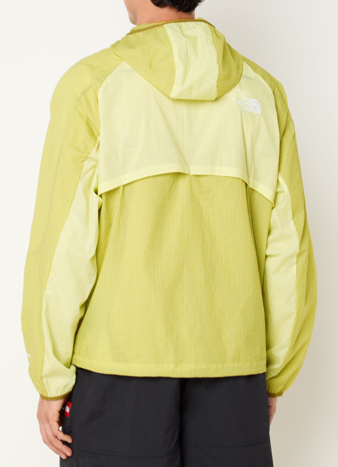 The North Face Windjack met capuchon en ritszakken - achterkant lichtgroen