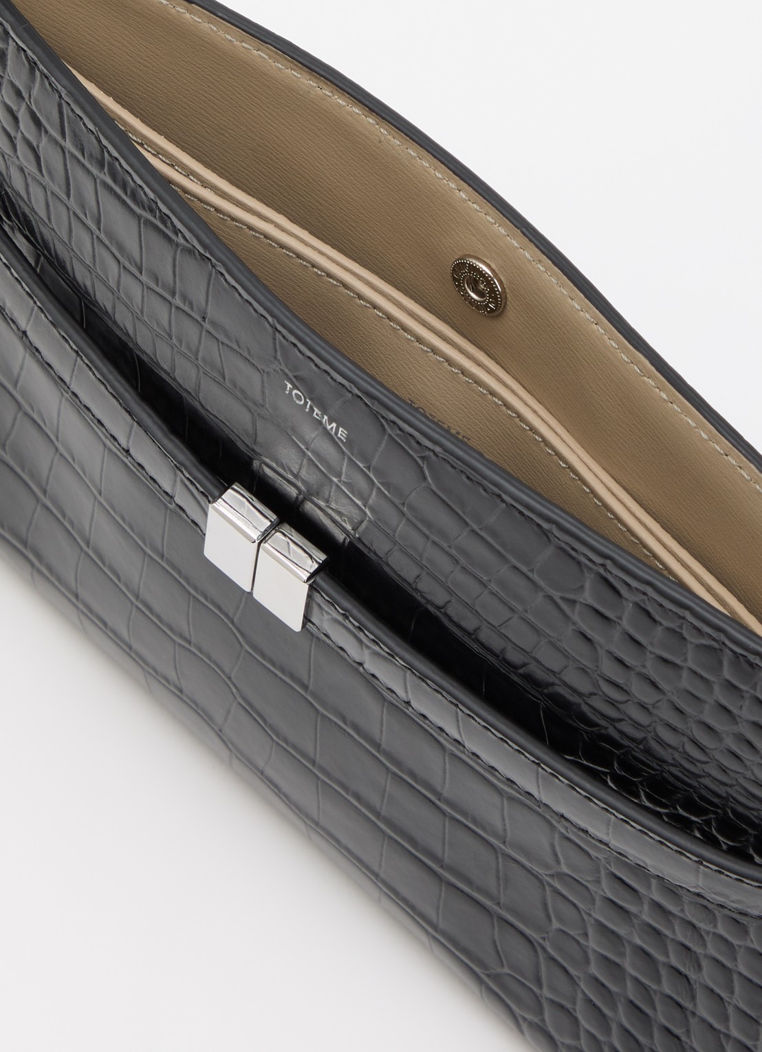 TOTEME Crossbody tas van kalfsleer en cocostructuur - detail zwart