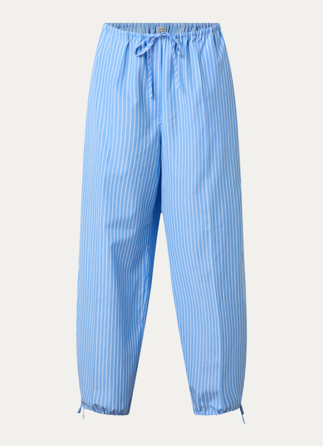TOTEME High waist tapered fit broek met streepprint en gestrikt detail - voorkant 4 lichtblauw