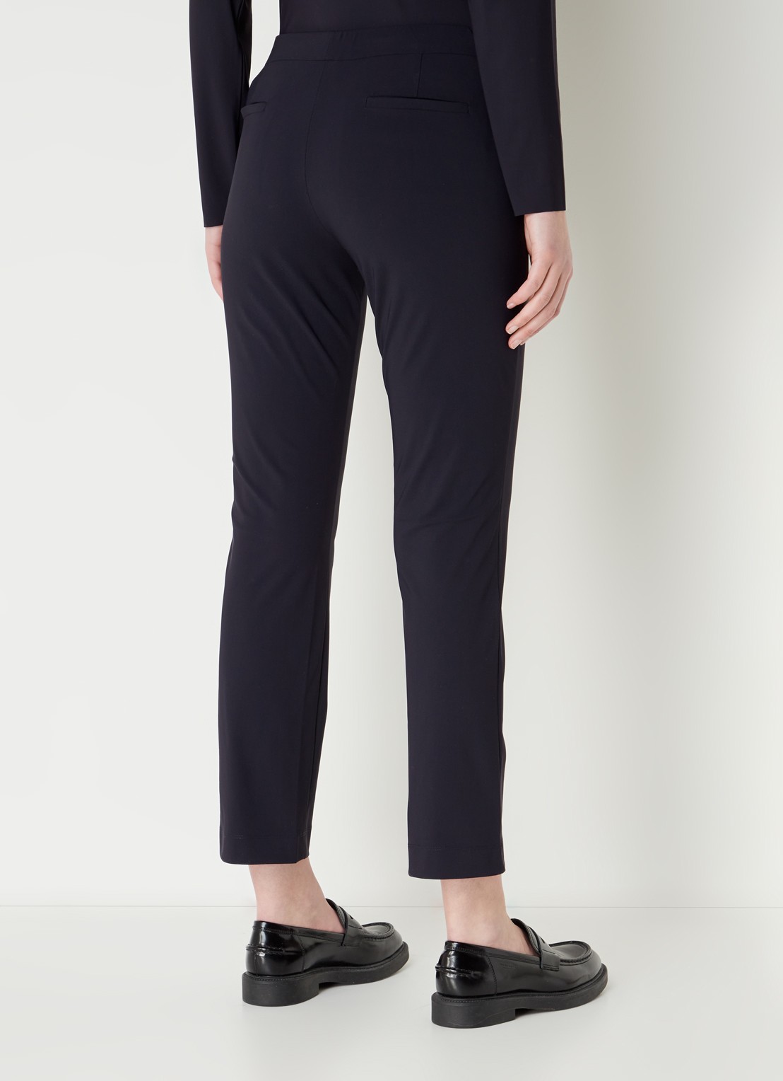 TRVL DRSS High waist slim fit pantalon van travelstof - achterkant blauw