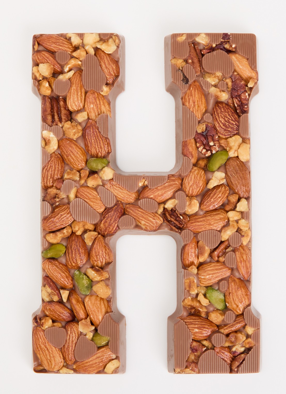 Urban Cacao Melk chocoladeletter met noten 180 gram - voorkant 2 h