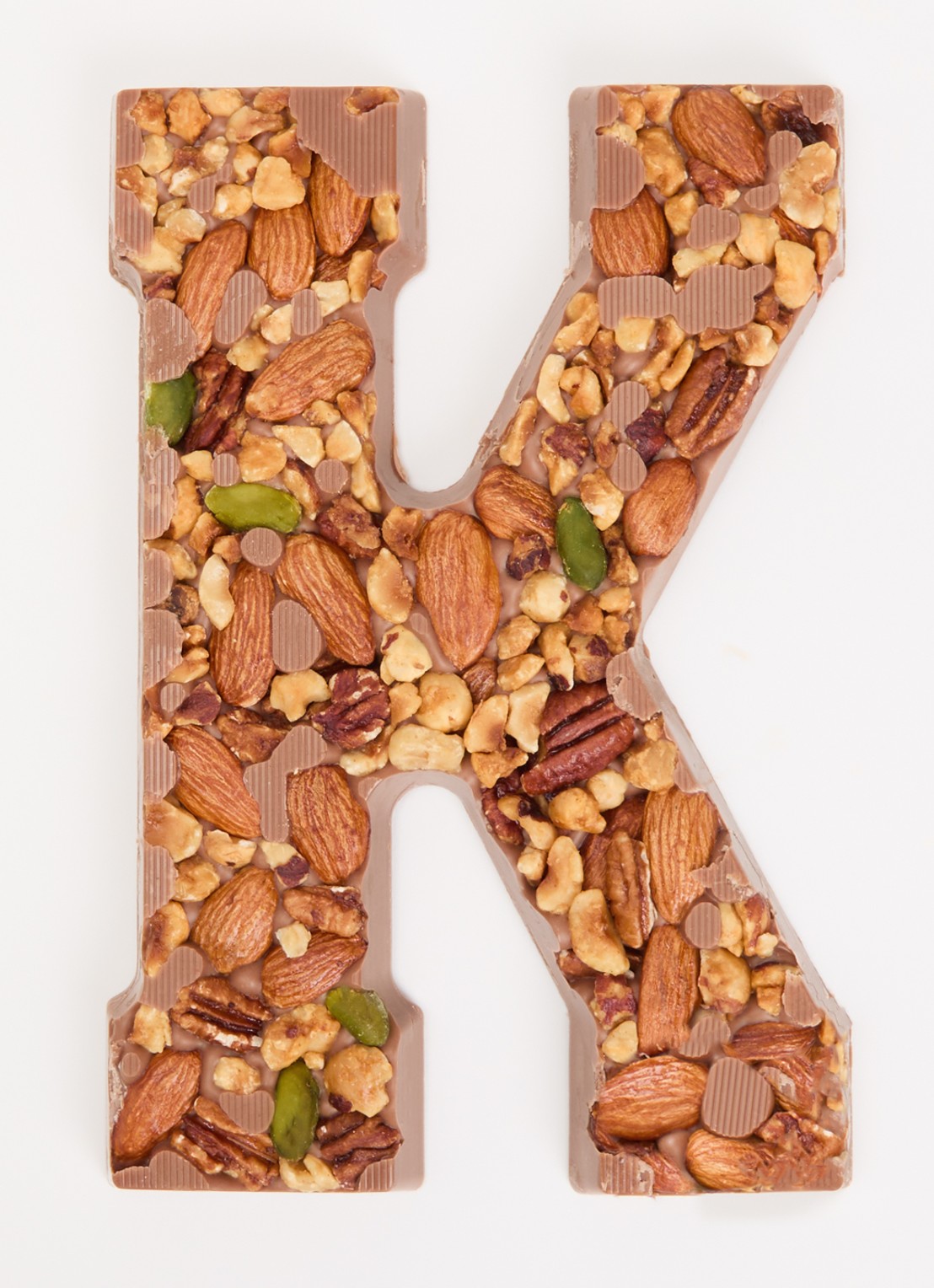 Urban Cacao Melk chocoladeletter met noten 180 gram - voorkant 2 k