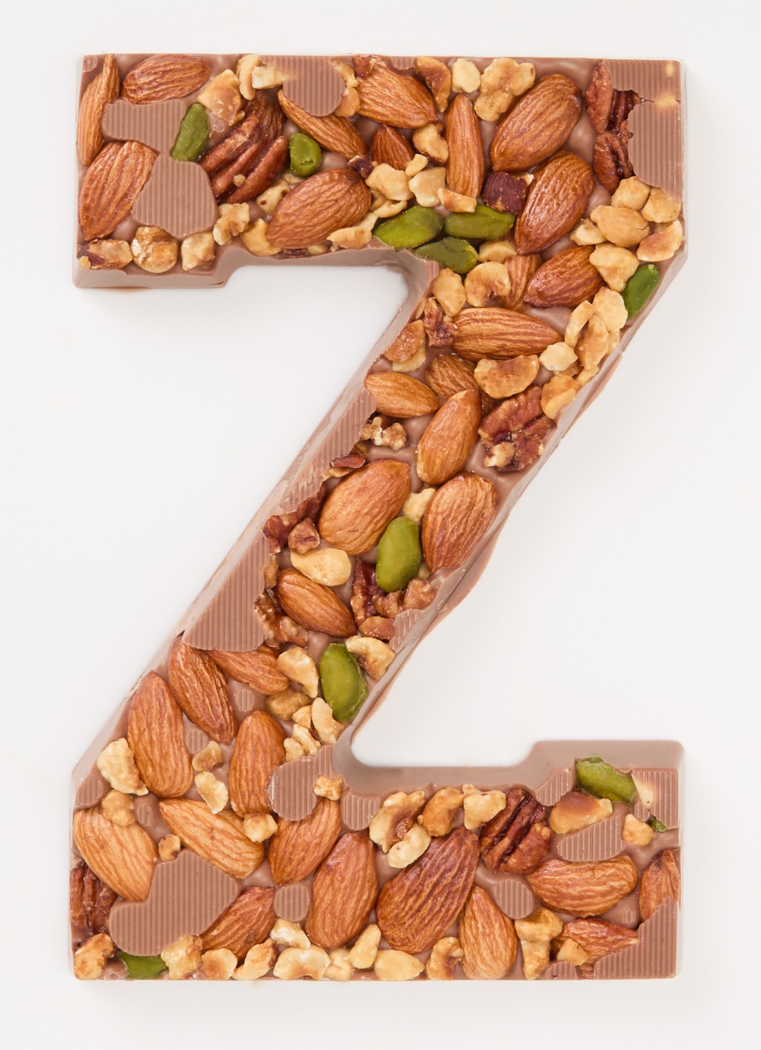 Urban Cacao Melk chocoladeletter met noten 180 gram - voorkant 2 z