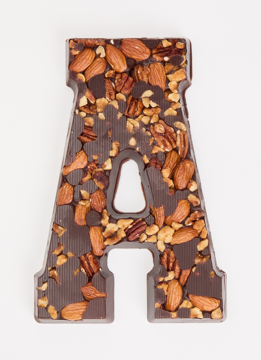 Urban Cacao Pure chocoladeletter met noten 180 gram - voorkant 3 a