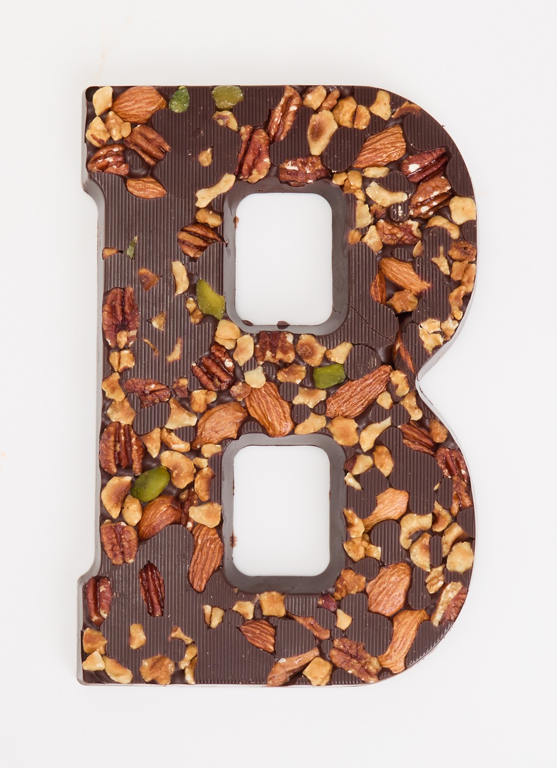 Urban Cacao Pure chocoladeletter met noten 180 gram - voorkant 2 b
