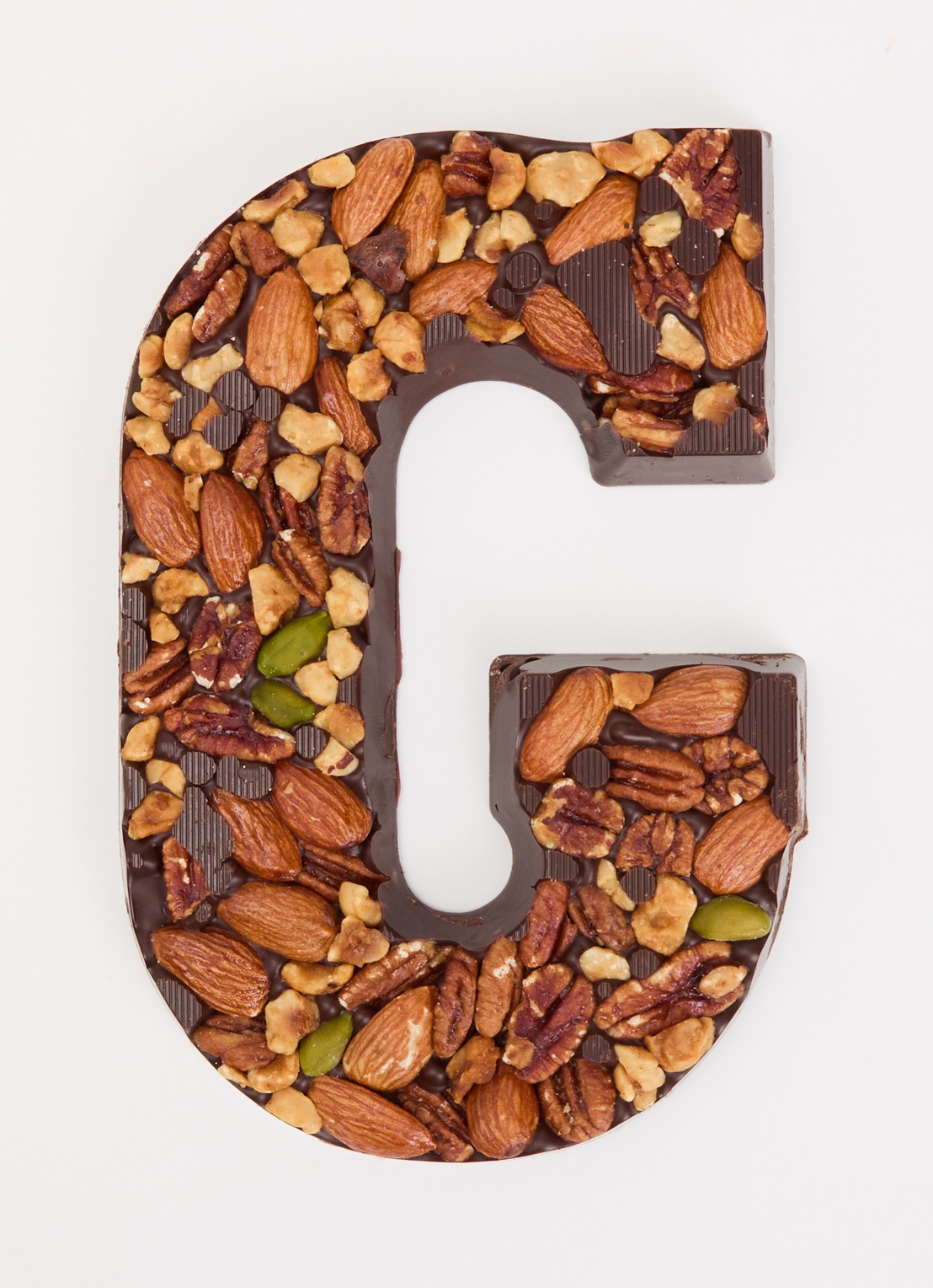 Urban Cacao Pure chocoladeletter met noten 180 gram - voorkant 2 g