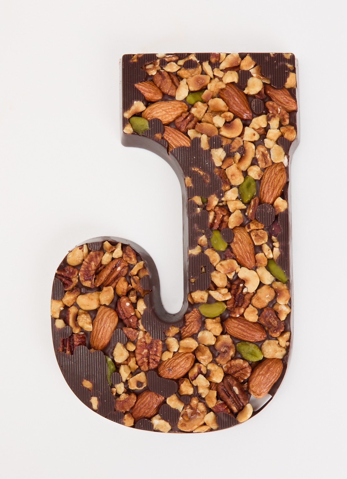 Urban Cacao Pure chocoladeletter met noten 180 gram - voorkant 2 j