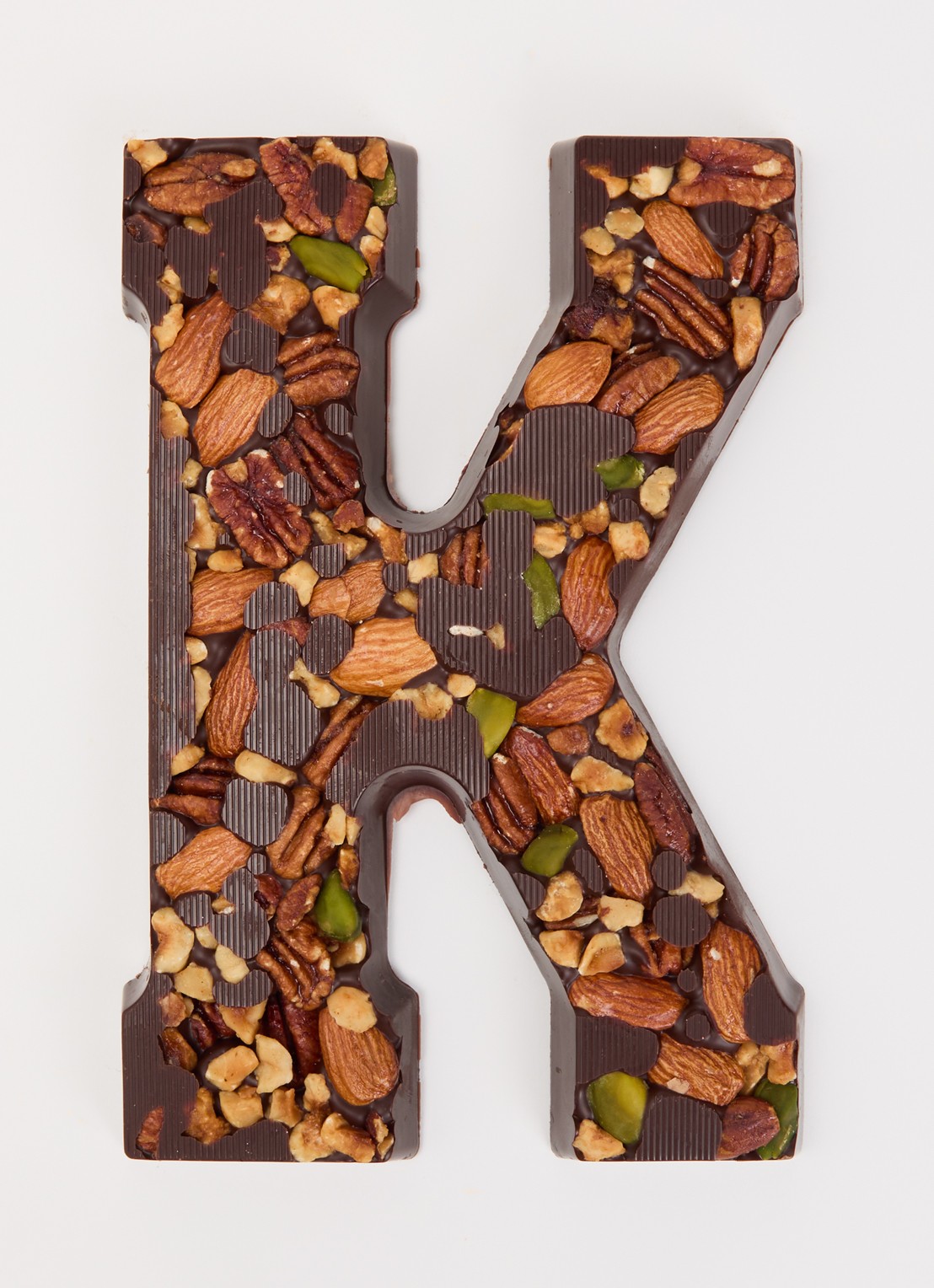 Urban Cacao Pure chocoladeletter met noten 180 gram - voorkant 2 k