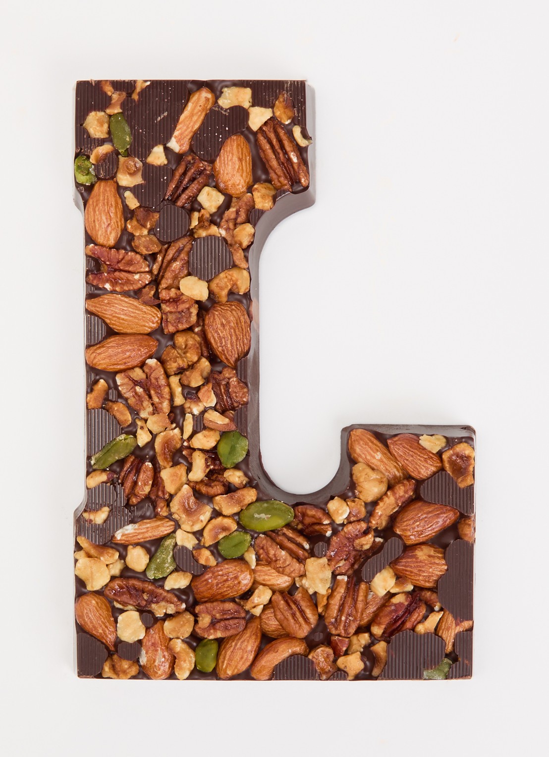 Urban Cacao Pure chocoladeletter met noten 180 gram - voorkant 2 l