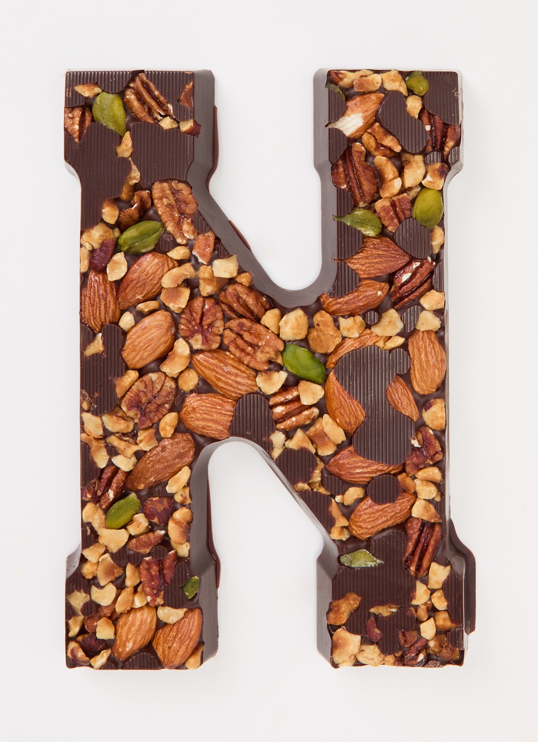 Urban Cacao Pure chocoladeletter met noten 180 gram - voorkant 2 n