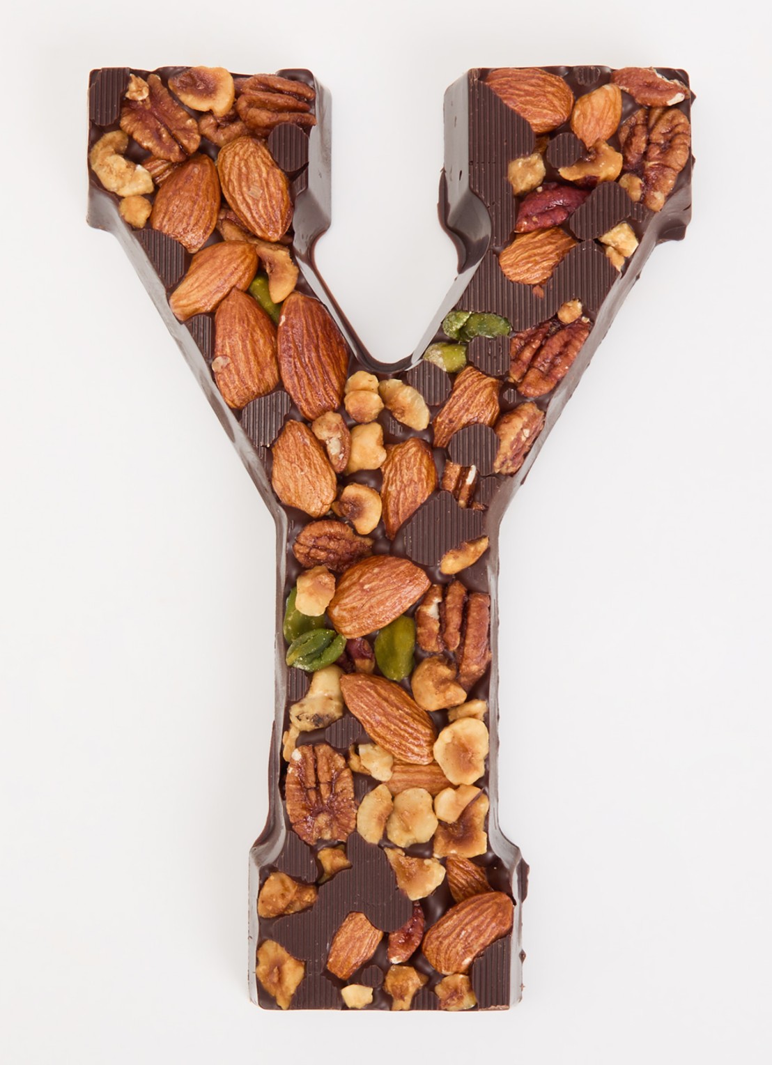 Urban Cacao Pure chocoladeletter met noten 180 gram - voorkant 2 y