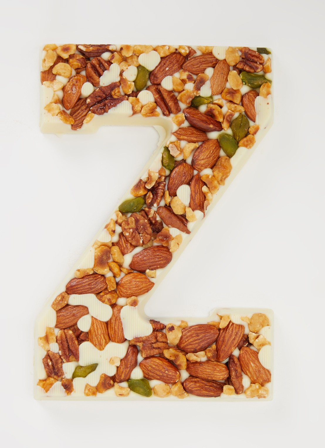 Urban Cacao Witte chocoladeletter met noten 180 gram - voorkant 2 z