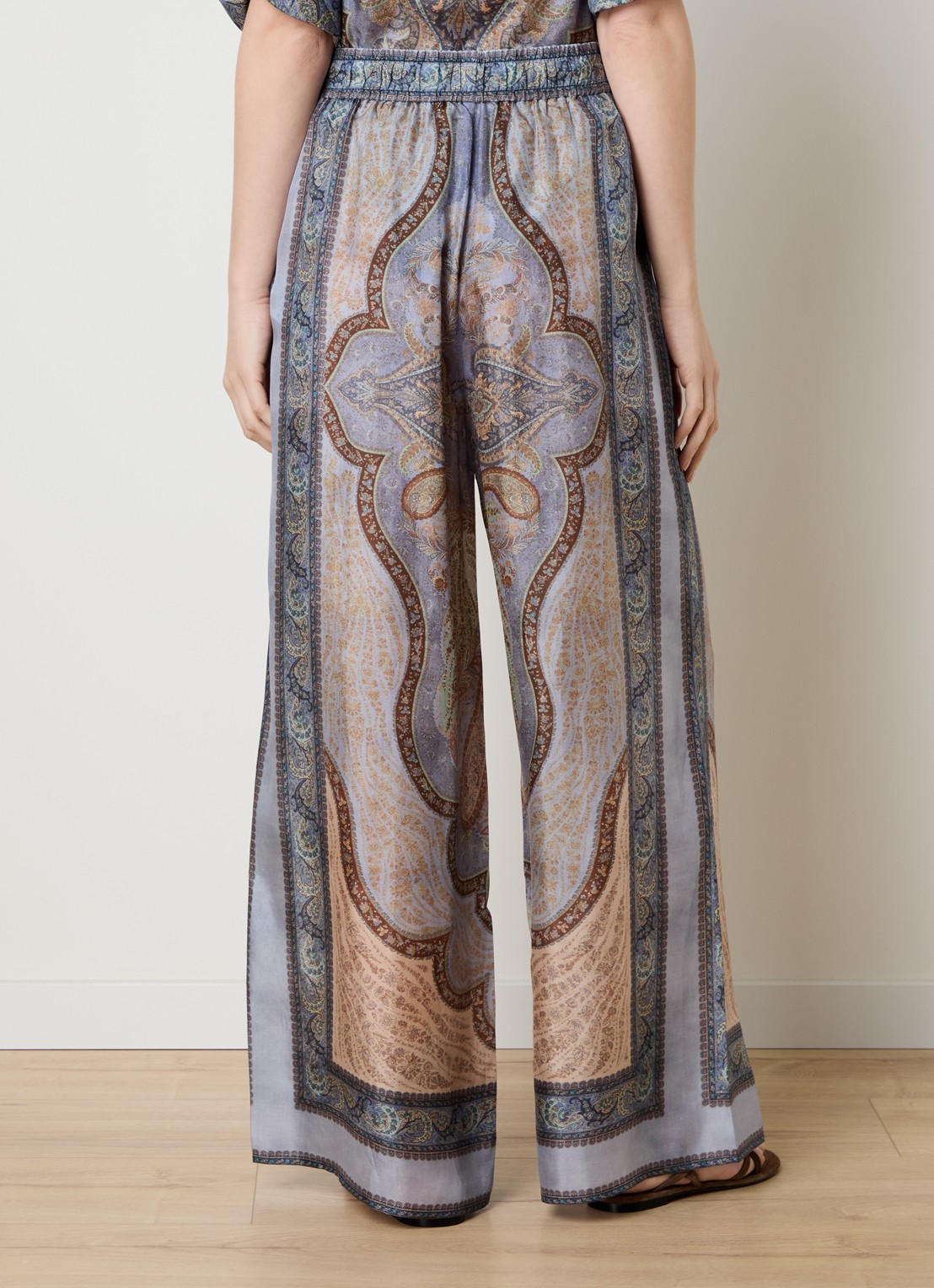 Zimmermann Wanderlust high waist wide fit palazzo broek van zijde met print - achterkant staalblauw