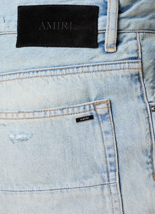 AMIRI MX1 loose fit jeans met destroyed afwerking - detail 4 lichtblauw