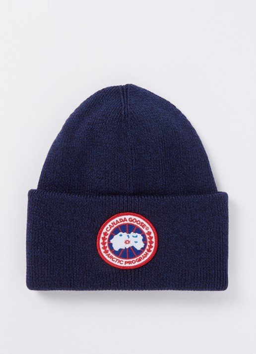Canada Goose Arctic Fijngebreide Muts Van Wol Met Logo Blauw De canada-goose-arctic-fijngebreide-muts-van-wol-met-logo-blauw-de