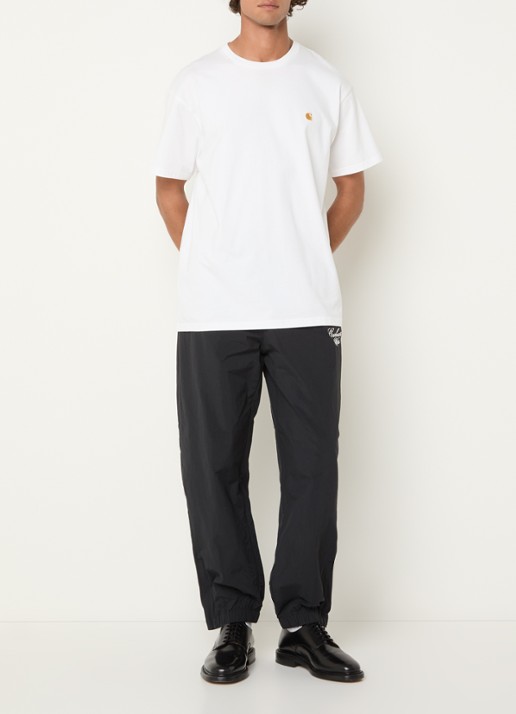 Carhartt WIP Tapered fit trackpants met logo en steekzakken - voorkant 2 zwart