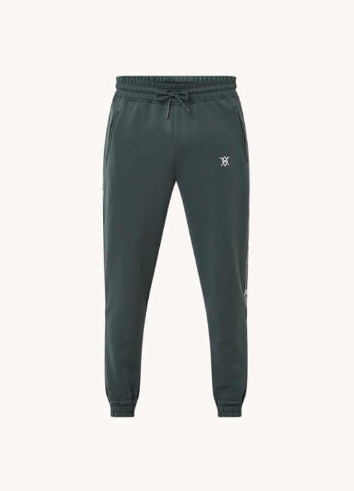Daily Paper Etape tapered fit cropped trackpants met ritszakken en logoband - voorkant bronsgroen
