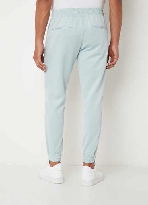 Daily Paper Etape tapered fit cropped trackpants met ritszakken en logoband - achterkant 3 mint