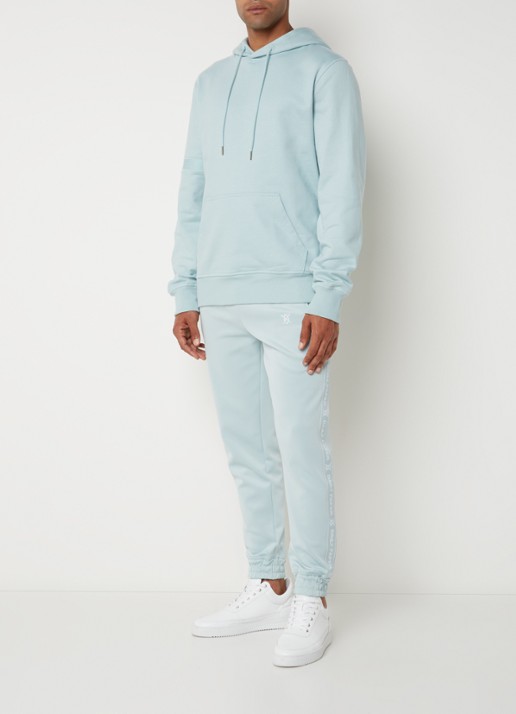 Daily Paper Etape tapered fit cropped trackpants met ritszakken en logoband - voorkant 5 mint