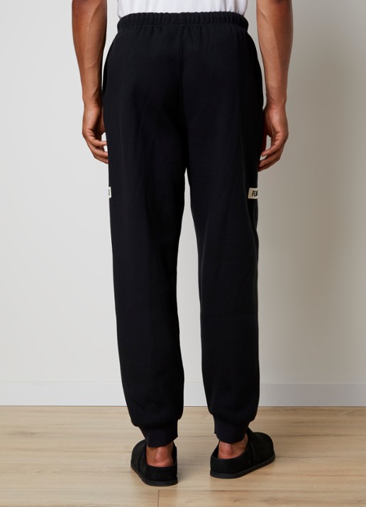 Fear of God Essentials Tapered fit joggingbroek met logo en steekzakken - achterkant zwart