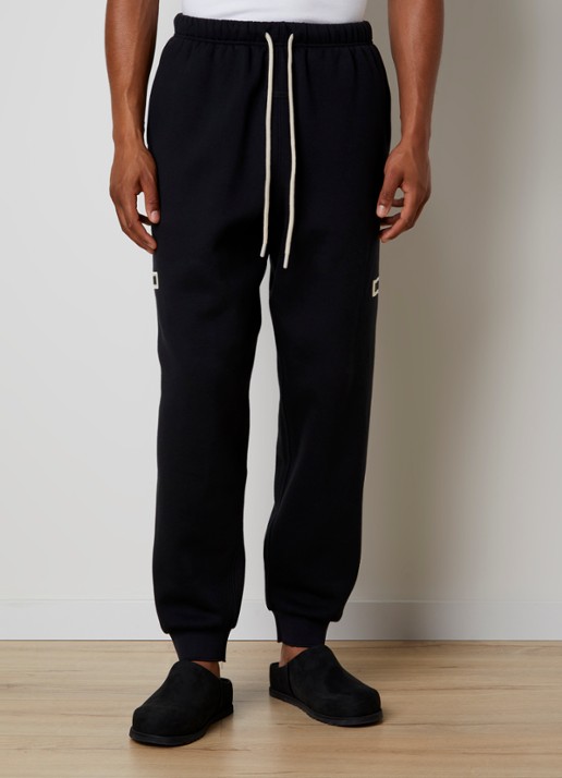 Fear of God Essentials Tapered fit joggingbroek met logo en steekzakken