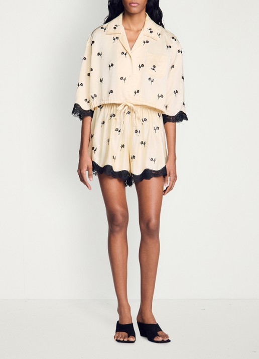 Sandro Cropped blouse met print en details van kant - voorkant vanilla / beige
