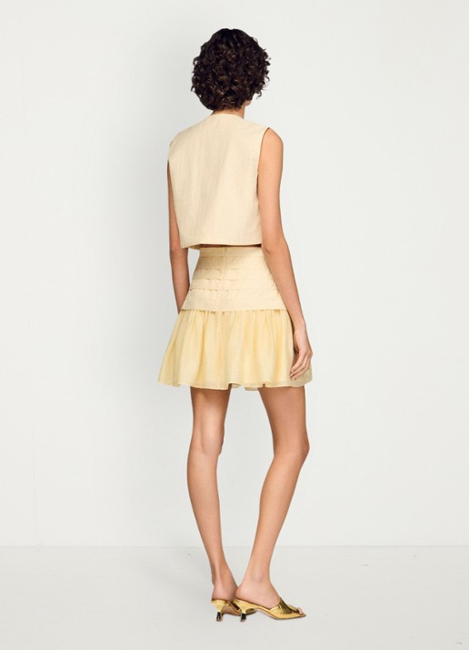Sandro Mini rok met plooien - achterkant 7 vanilla / geel