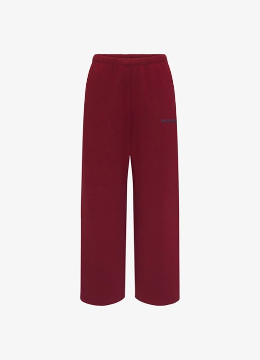 SKIMS Cotton Fleece low waist straight fit joggingbroek met logo - voorkant 2 bordeauxrood