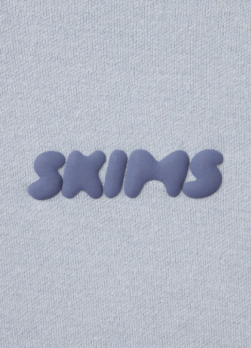 SKIMS Cotton Fleece low waist straight fit joggingbroek met logo - detail 5 lichtblauw