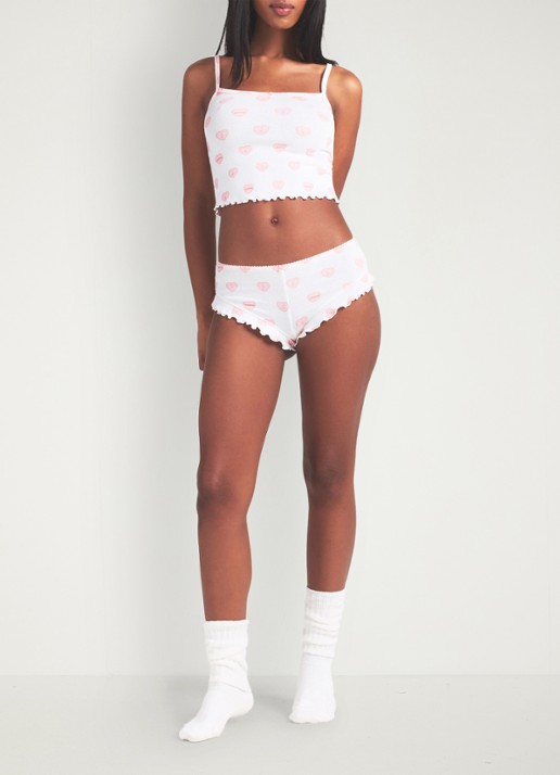 SKIMS Pointelle pyjamaset met print  - voorkant 6 snow lace hearts