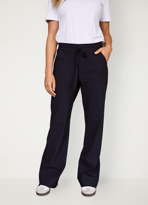 Studio Anneloes Abigail mid waist flared fit joggingbroek van travelstof