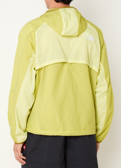The North Face Windjack met capuchon en ritszakken - achterkant lichtgroen