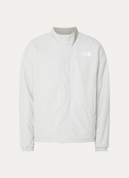 The North Face Yumiori reversible jack van teddy met ritszakken - voorkant lichtgrijs