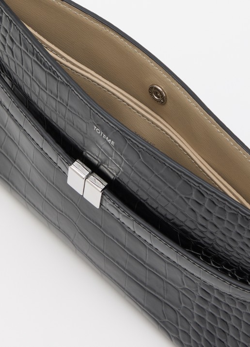 TOTEME Crossbody tas van kalfsleer en cocostructuur - detail zwart