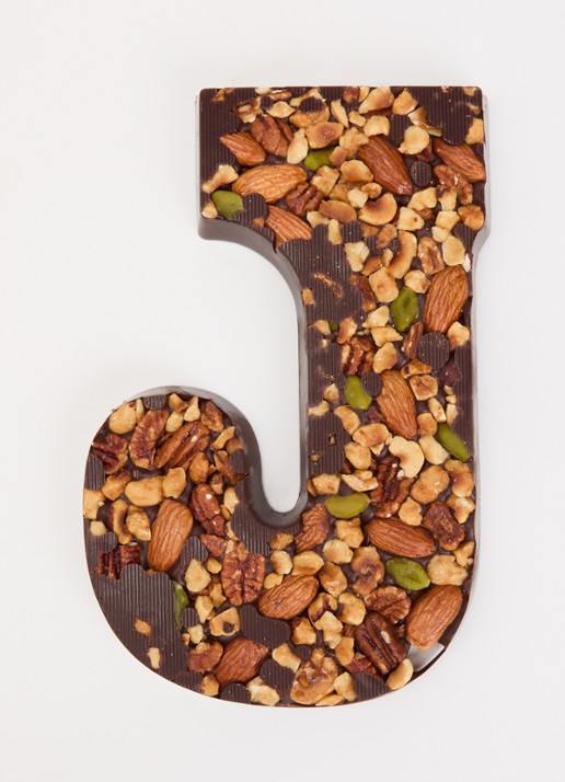 Urban Cacao Pure chocoladeletter met noten 180 gram - voorkant 2 j