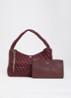 Deliberate schoudertas met gevlochten detail en uitneembaar etui - Bordeauxrood