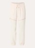 High waist tapered fit trackpants met elastische band en ritszakken - Creme